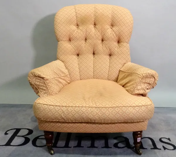 A Victorian style hardwood framed low armchair on turned supports, 87cm wide x 98cm high.