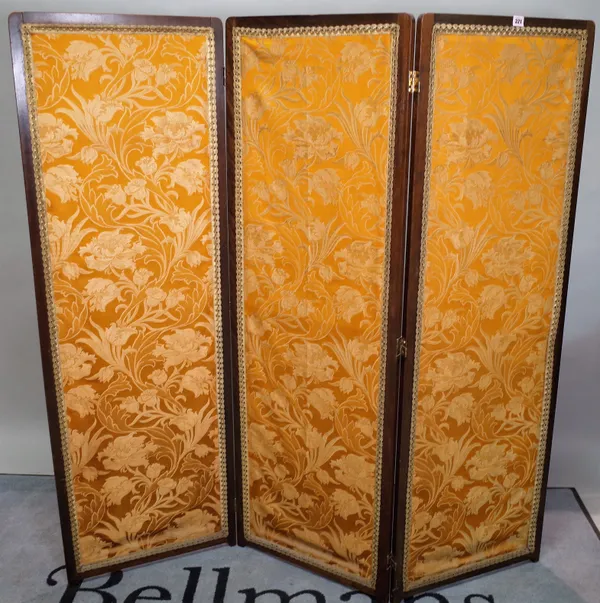 An early 20th century stained beech three fold upholstered screen, 50cm wide x 153cm high, 150cm fully extended.