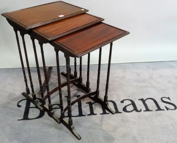 A Regency mahogany nest of three occasional tables, the largest 48cm wide x 71cm high, (3).