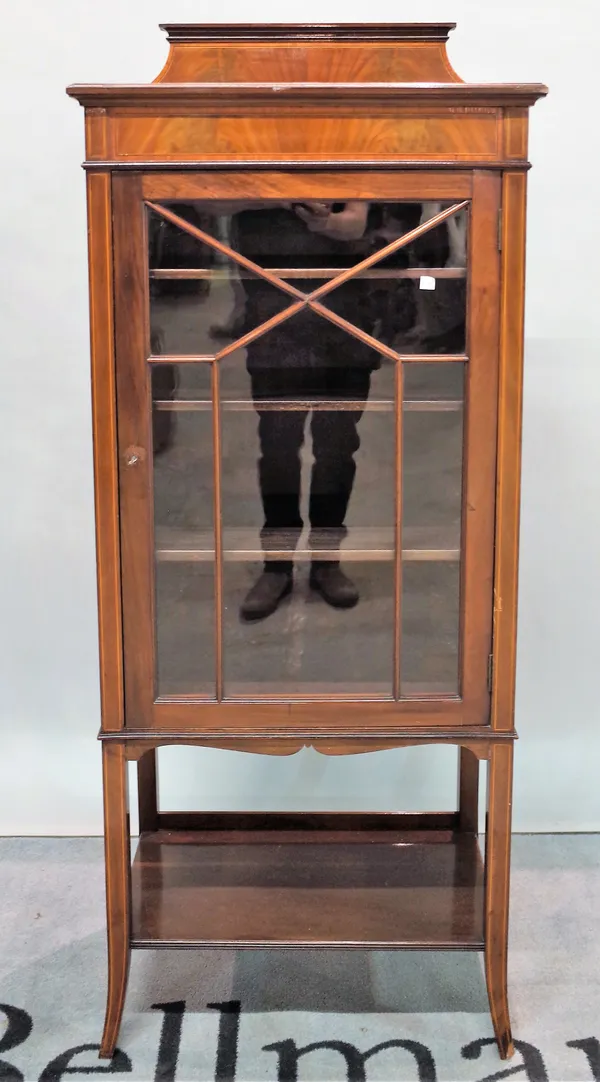 An Edwardian inlaid mahogany display cabinet, platform undertier on tapering square supports, 61cm wide x 149cm high.