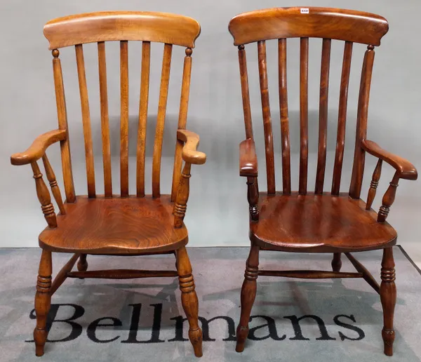 A near pair of 19th century ash and elm stick back open armchairs, ring tuned supports, 57cm wide x 114cm high, (2).