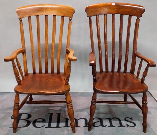 A near pair of 19th century ash and elm stick back open armchairs, ring tuned supports, 57cm wide x 114cm high, (2).