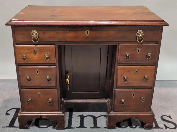 A late George III mahogany kneehole desk, with seven drawers about the knee on bracket feet, 94cm wide x 78cm high.