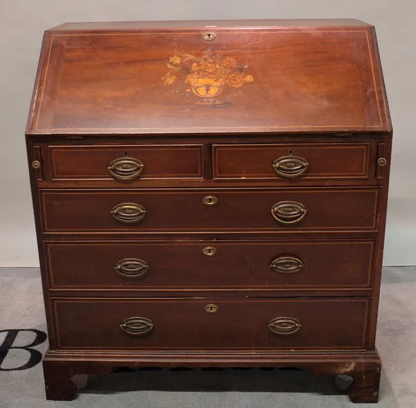 An Edwardian inlaid mahogany bureau, with two short and three long graduated drawers on bracket feet, 95cm wide x 106cm high.