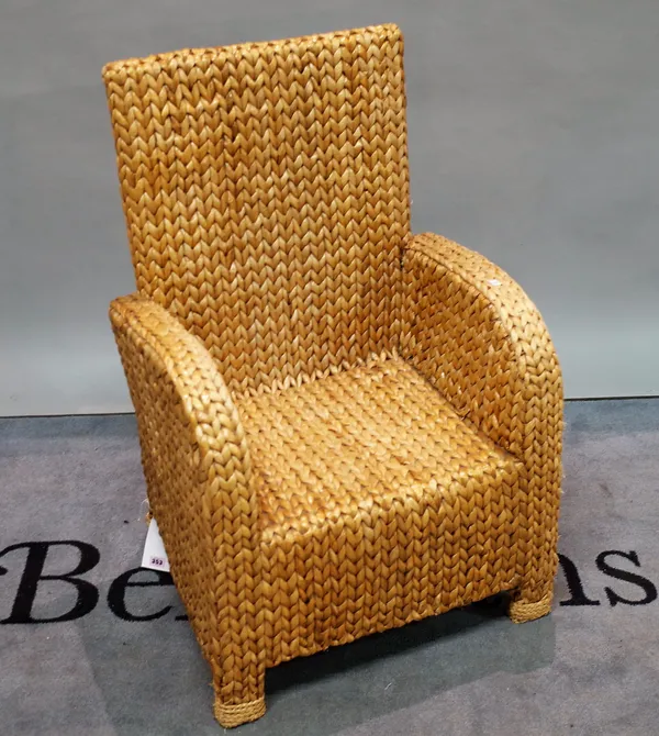 A mid-20th century rattan weave armchair, 62cm wide x 95cm high.