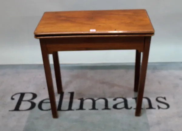 A late 18th century mahogany fold over tea table, 73cm wide x 71cm high.