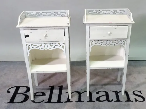 A pair of 20th century single drawer bedside tables, 40cm wide x 70cm high.