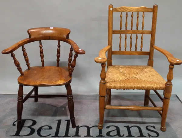 A 19th century ash and elm bar back smoker's armchair, 68cm wide x 78cm high, and an early 20th century elm spindle back open armchair, 65cm wide x 10