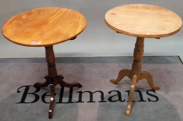 A 19th century mahogany tripod table on turned column outswept supports, 59cm diameter x 72cm high, and a later pine tripod table, 54cm wide x 75cm hi