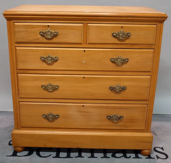 An early 20th century cherrywood chest with two short and three long drawers on bun feet, 107 wide x 110cm high.