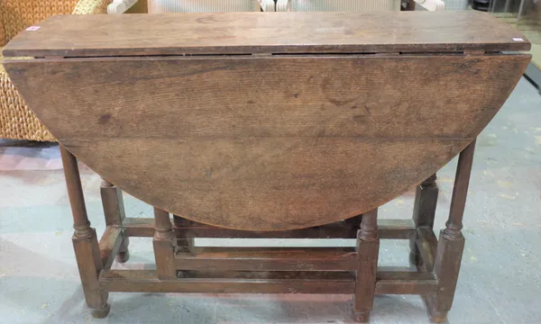 An 18th century and later oak dining table, 106cm wide x 72cm high.