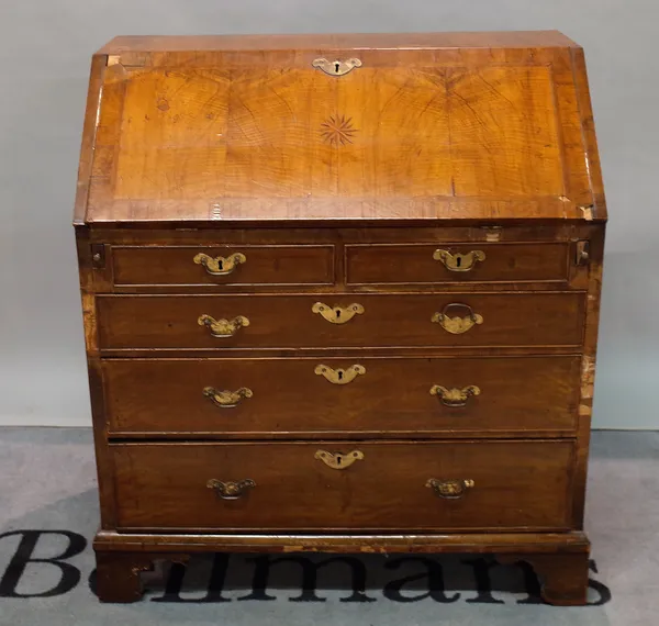 A late George II walnut bureau with two short and three long drawers on bracket feet, 92cm wide x 103cm high.