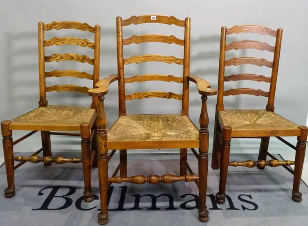 A set of four oak and elm ladderback dining chairs and one carver, 59cm wide x 104cm high, (4).