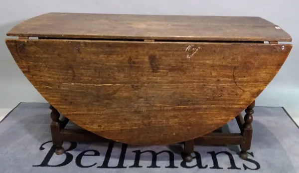 An 18th century and later oak single drawer gateleg dining table, on turned supports, 146cm wide x 75cm high.