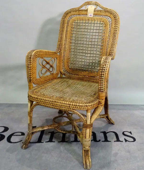 An early 20th century American bamboo and wicker armchair, 61cm wide x 115cm high.