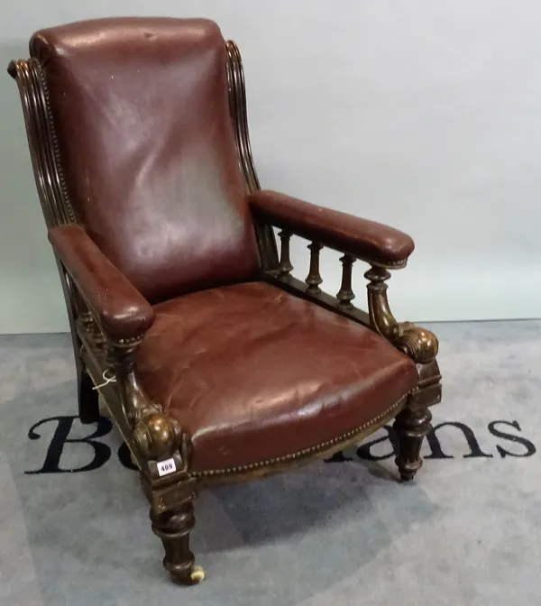 An early Victorian mahogany framed low armchair with reeded tapering supports, 64cm wide x 94cm high.