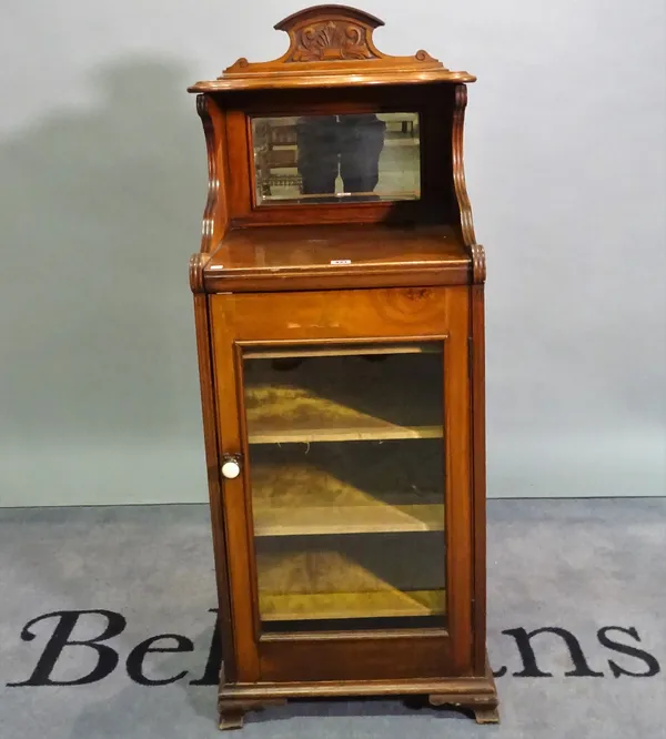 A late Edwardian mahogany side cabinet with bevelled glass door on a plinth base, 110cm wide x 91cm high.