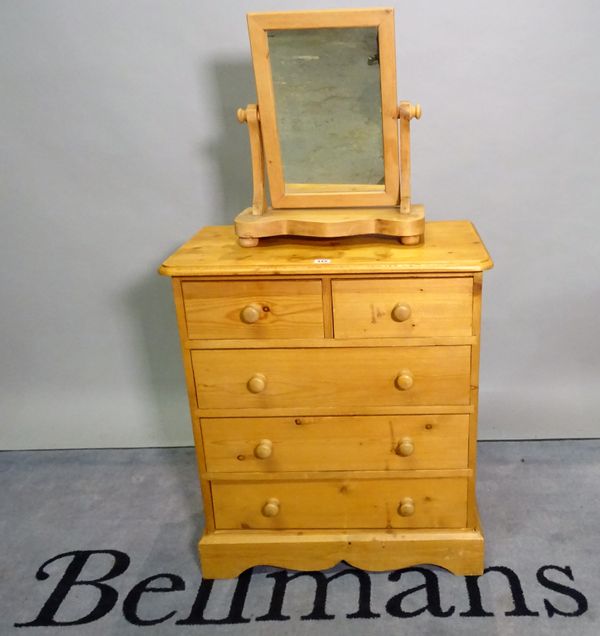 A 20th century pine chest of two short and three long drawers, 66cm wide x 77cm high, and a 20th century pine swing frame mirror, 41cm wide x 49cm hig