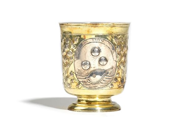 An 18th century Russian parcel gilt beaker, the body with three oval reserves, having Latin mottos, otherwise decorated with three cornucopia motifs,