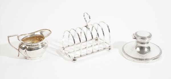 Silver and silver mounted wares, comprising; a seven bar toastrack, of faceted arch form, with a loop shaped handle, Sheffield 1889, a milk jug, Birmi