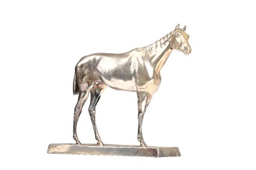 A silver plated model of a standing horse, on a rectangular rustic base, length of base 20cm. Illustrated.
