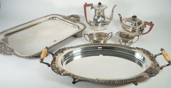 A group of plated wares, comprising; a rectangular large twin handled tray, decorated with a gadrooned rim, raised on four feet, a shaped oval twin ha