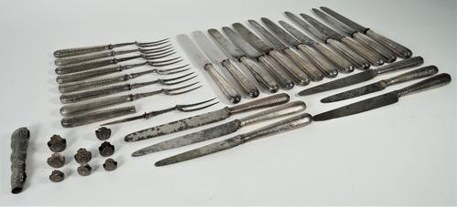 A group of table flatware, comprising; sixteen steel bladed table knives, with loaded silver handles, two re-bladed steel bladed table knives, with lo