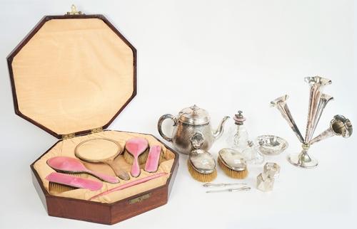 A lady's silver and pink enamel mounted five piece dressing set, comprising; a hand mirror, two hairbrushes and two clothes brushes, Birmingham 1927 a