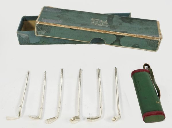 A set of six Scottish silver cocktail sticks, designed as a set of six golf clubs, Edinburgh 1928, weight 30.5 gms, by A.T. Reid, St Andrews, with a m