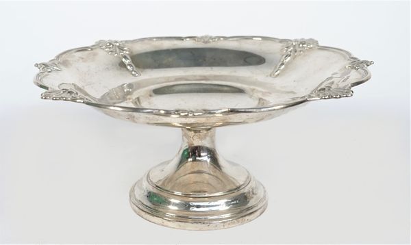 A silver pedestal dish, of shaped circular form, the rim decorated with scallop motifs at intervals, raised on a circular foot, diameter 22.5cm, weigh