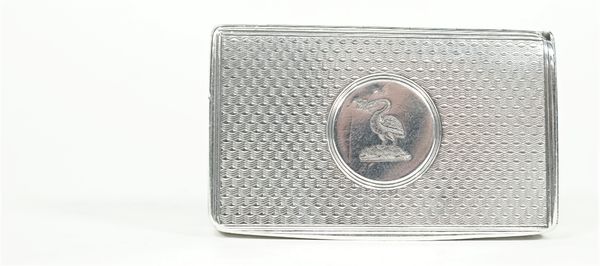 A Victorian silver vesta case, of rectangular form, having all over engine turned decoration, the centre of the cover with a circular plaque engraved