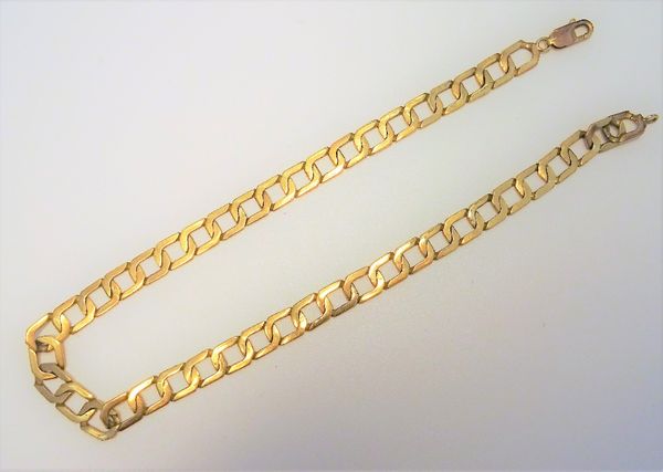 A gold neckchain, in a faceted openwork rectangular link design, on a sprung hook shaped clasp, detailed 375, length 42.5cm, weight 35 gms.