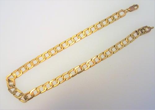 A gold neckchain, in a faceted openwork rectangular link design, on a sprung hook shaped clasp, detailed 375, length 42.5cm, weight 35 gms.
