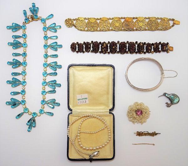 A single row necklace of graduated cultured pearls, on a marcasite clasp, with a case, a pale blue and colourless paste costume necklace, two bracelet