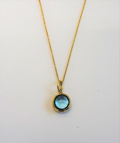 A Tiffany & Co Paloma Picasso 18ct gold and cabochon blue topaz single stone pendant, detailed T & Co AU 750, with a Tiffany & Co 18ct gold oval link