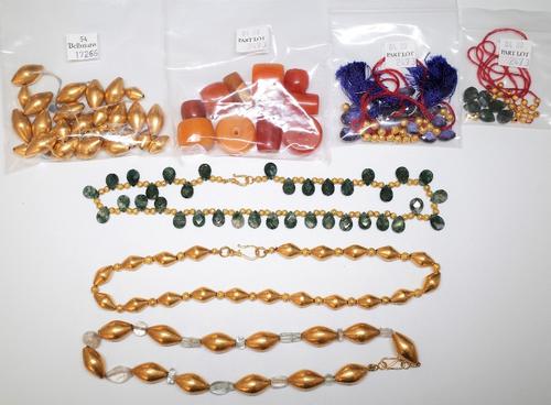 A moss agate bead necklace, formed as a row of faceted pear shaped moss agate beads, two single row necklaces of gilt beads and a quantity of further