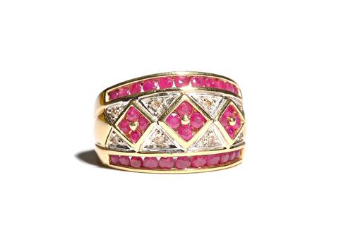 A gold, ruby and diamond set ring, with three ruby set square shaped clusters to the centre, between circular cut ruby set sides and otherwise mounted