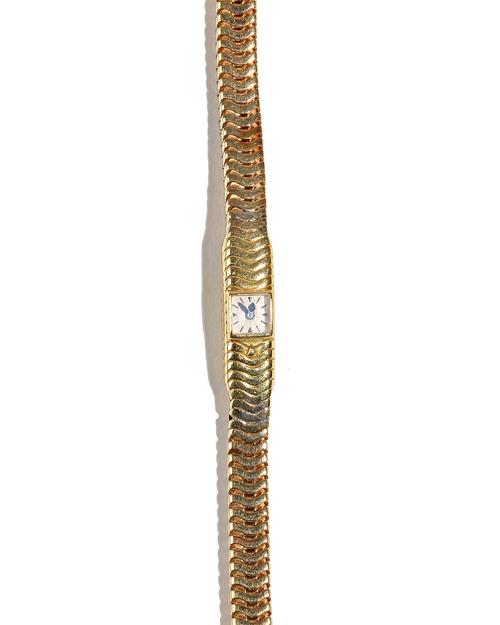 A lady's gold rear winding cocktail bracelet wristwatch, the minute square dial with baton and triangular numerals and with blued steel hands, the bra