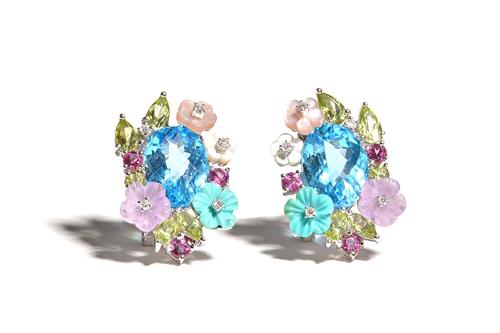 A pair of 14ct white gold, blue topaz, varicoloured gemstone and stained mother-of-pearl set earclips, each mounted with an oval cut blue topaz to the
