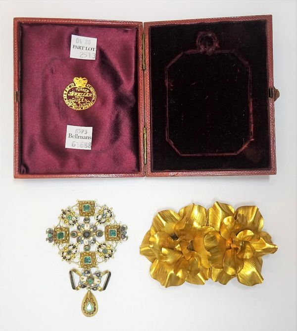 A foil backed emerald, gilt, enamelled and gem set pendant, in a Renaissance revival design, with an associated case and a gilt metal dress clip, desi