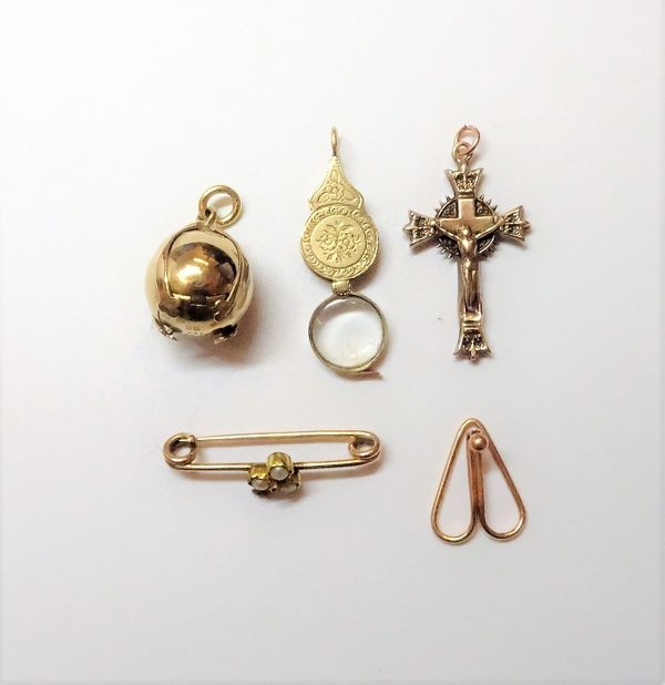 A gold cased silver Masonic ball pendant, opening to reveal engraved Masonic symbols, detailed 9 CT, a Victorian small folding spy glass, a rose diamo