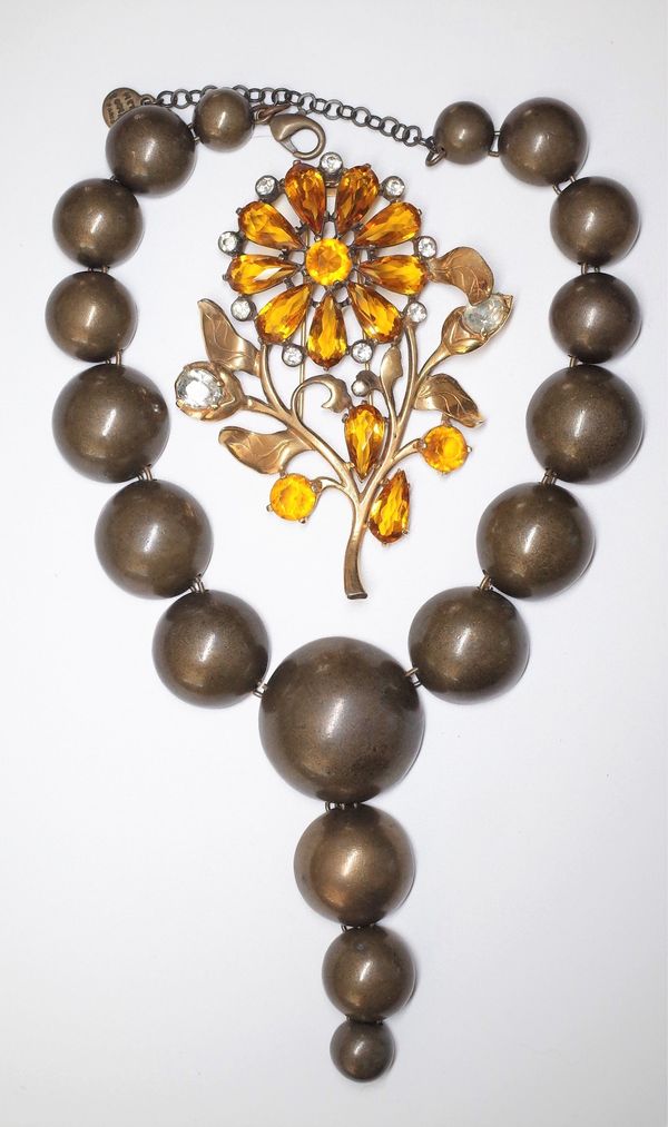 An Eisenberg Original gilt metal, yellow and colourless paste set brooch, circa 1940s, designed as a flower spray and a Pointu's Paris necklace, forme