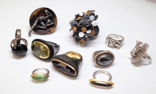 A Scottish silver and gilt ring, of multiple circular abstract design, a dark smoky quartz solitaire ring, detailed Silver, a haematite single stone r