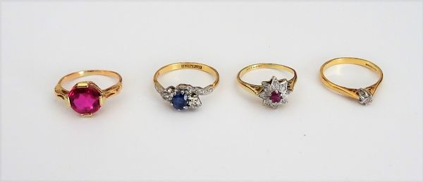 A gold and platinum, ruby and diamond ring, designed as a star, detailed 18 CT & PT, a gold and platinum, sapphire and diamond three stone ring, in a