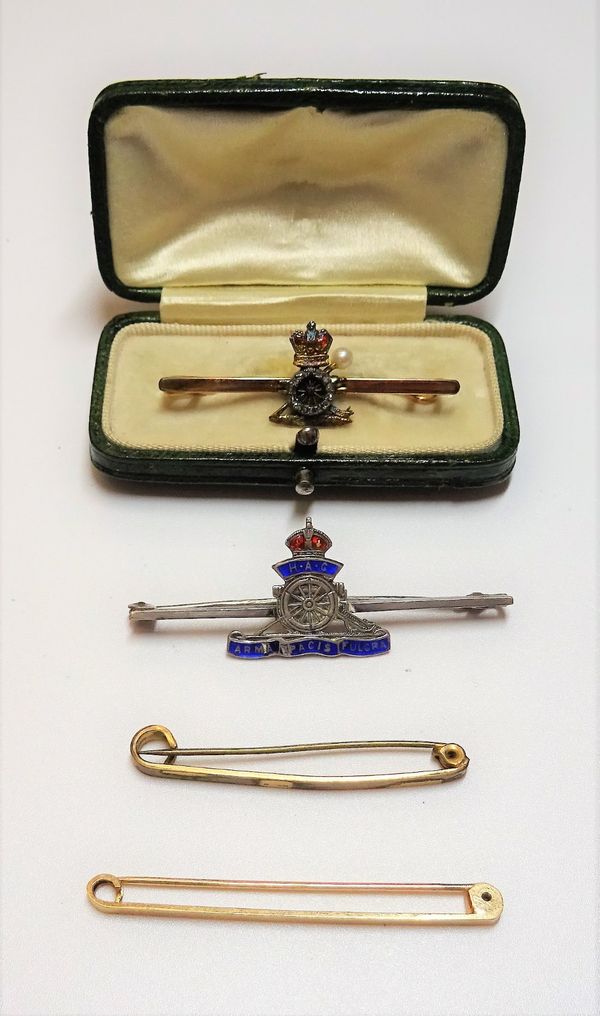 A gold, rose diamond and pearl set and enamelled bar brooch, designed as a badge of The Royal Artillery, cased, a Sterling silver and enamelled Royal