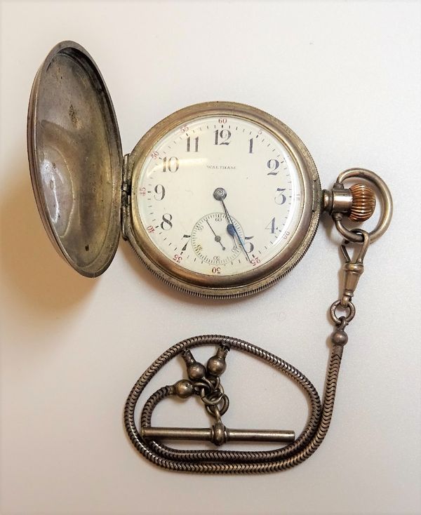 A Waltham silver cased, keyless wind, hunting cased gentleman's pocket watch, Birmingham 1919, with a Brazil link watch Albert chain.