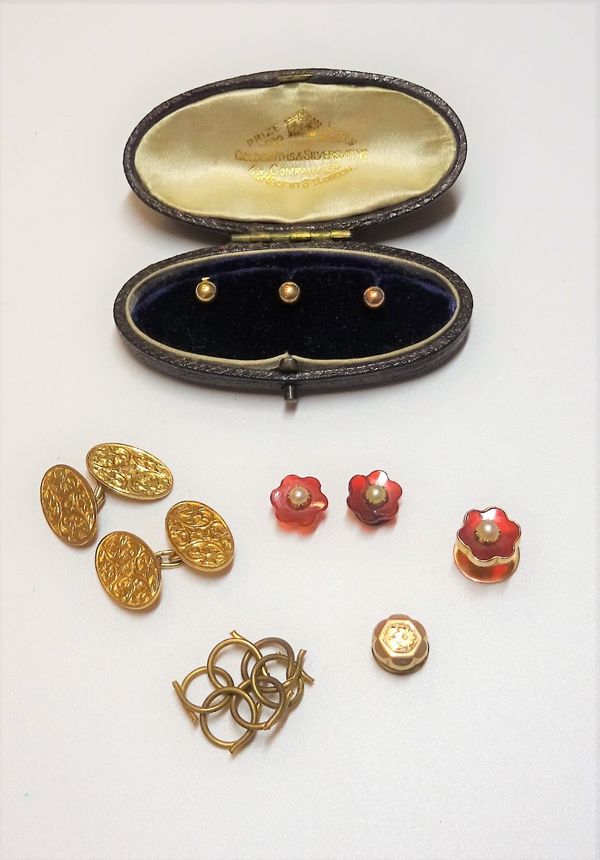 A pair of 9ct gold oval cufflinks, with engraved decoration, Birmingham 1913, weight 4.5 gms, a set of three 18ct gold dress studs, weight 2.7 gms, wi