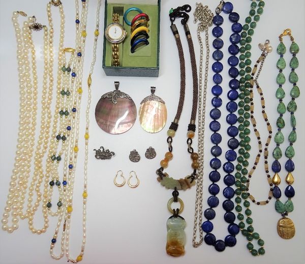 A group of jewellery comprising; six cultured and freshwater cultured pearl necklaces, a lapis lazuli disc shaped bead necklace, four further stone ne