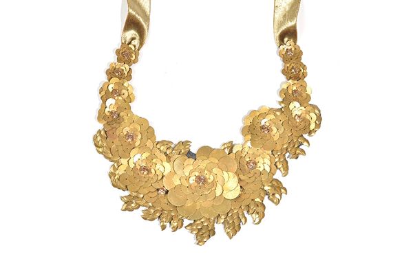 A Liberty of London brass and champagne coloured paste collar necklace, of floral and foliate abstract design, fitted to a textile cord, with a box. I