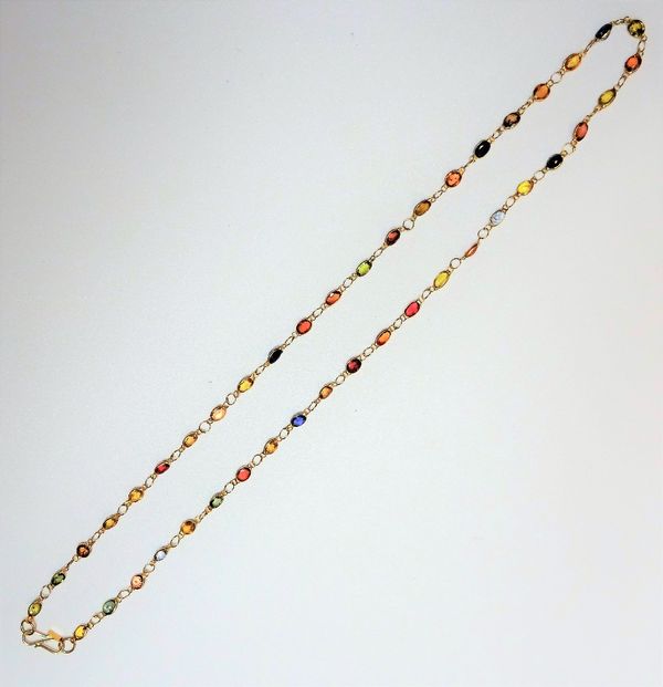 A gold and multi-coloured sapphire set necklace, mounted with oval cut sapphires in multi colours, between circular links to a hook fastening, length